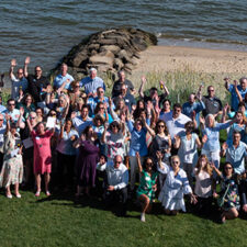 All employee group photo on the beach