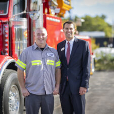 Rob Carey stands with Nathan Buckler of Buckler's Towing Service at his Mashpee space.