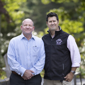 Glenn FitzGerald stands with Bruno Arraes, owner of MBR Landscaping in Centerville.